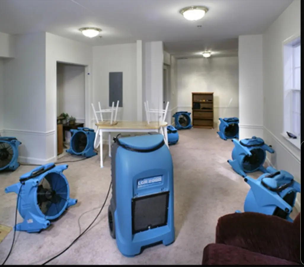 Air movers and dehumidifier setup for Water Damage Restoration in Hartland
