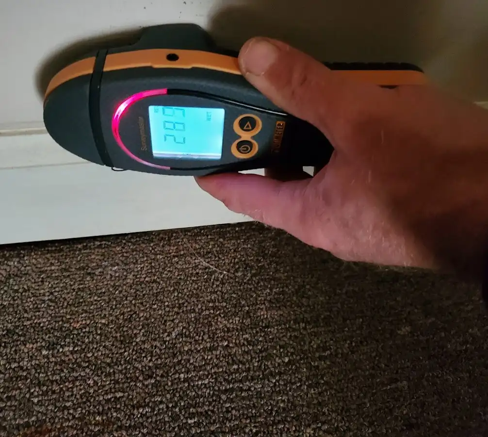Moisture detection at baseboard during Storm Damage Restoration in Hartland